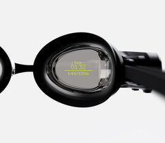 Close-up of a swim goggle lens displaying augmented reality data including time and heart rate during a swim.