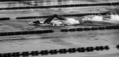 a person swimming freestyle stroke in the pool